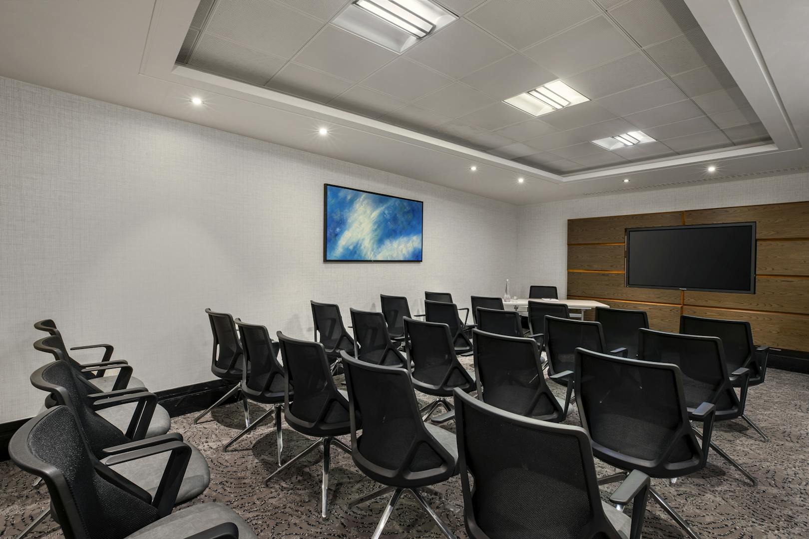 Modern meeting room at St Pauls Hotel with sleek chairs, ideal for presentations and events.