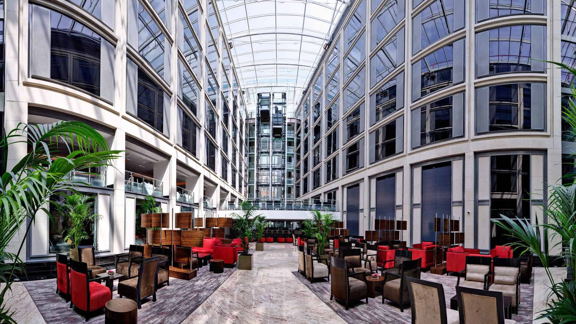 Spacious meeting room atrium with natural light, ideal for networking events.