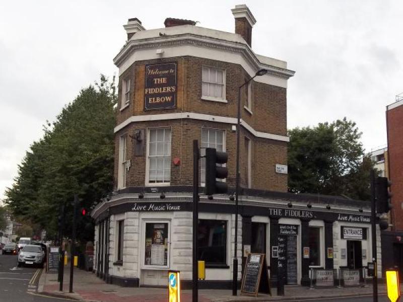 Charming pub exterior at The Fiddler's Elbow, ideal for networking events and casual meetings.