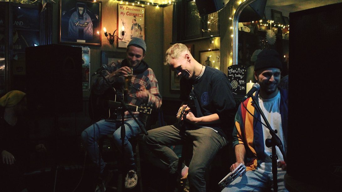 Lively acoustic performance at Back Bar, The Fiddler's Elbow, perfect for events.