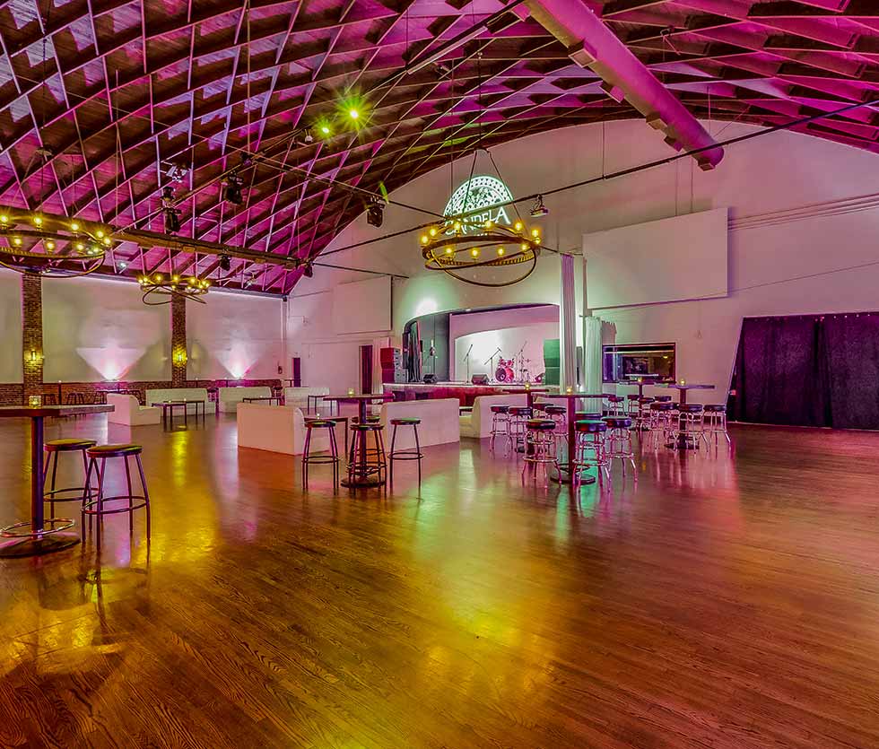 Versatile event space with high ceilings, ideal for corporate and social gatherings.