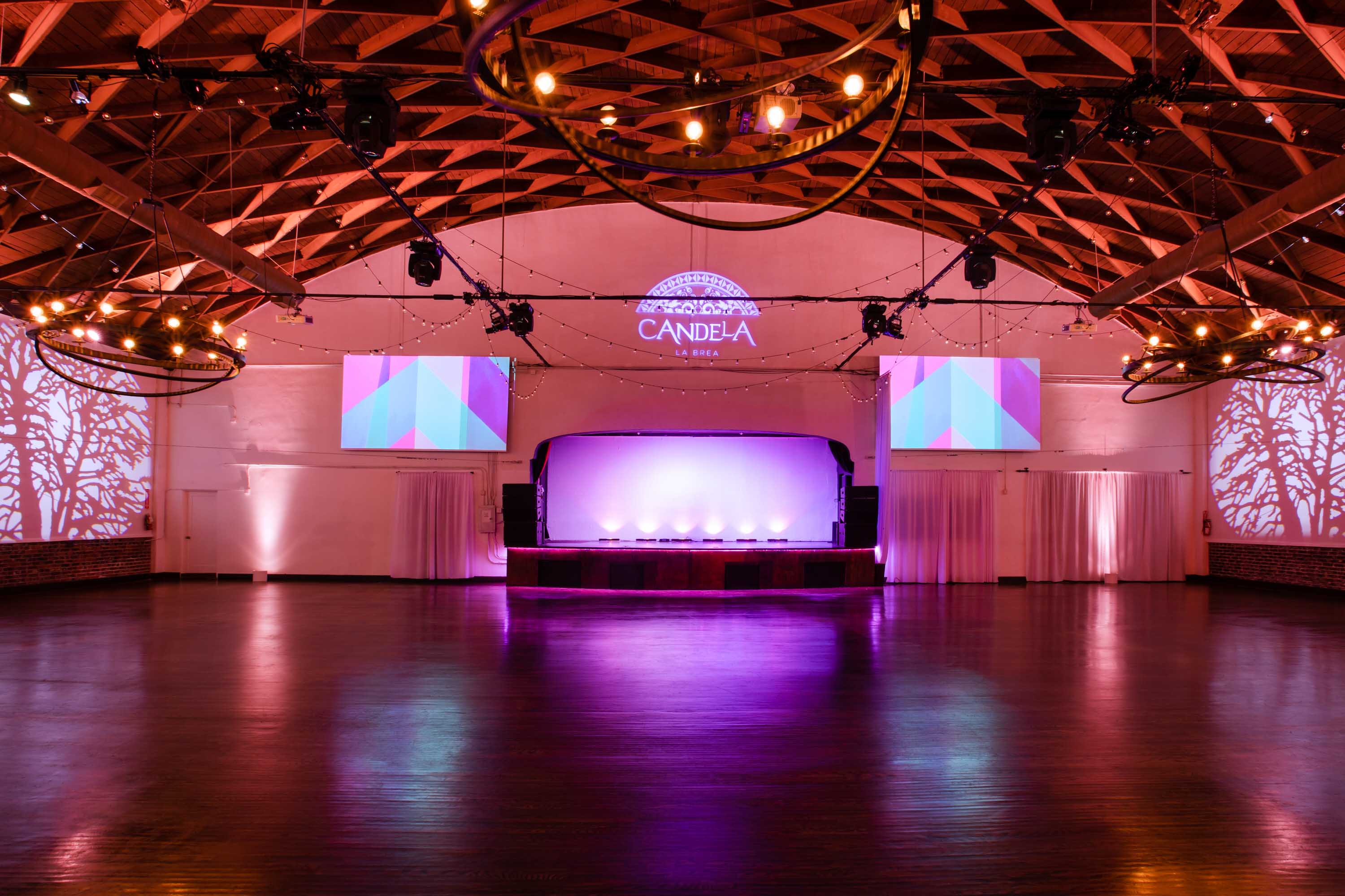 Versatile LOFT event space with wooden floor and elegant lighting for conferences and galas.
