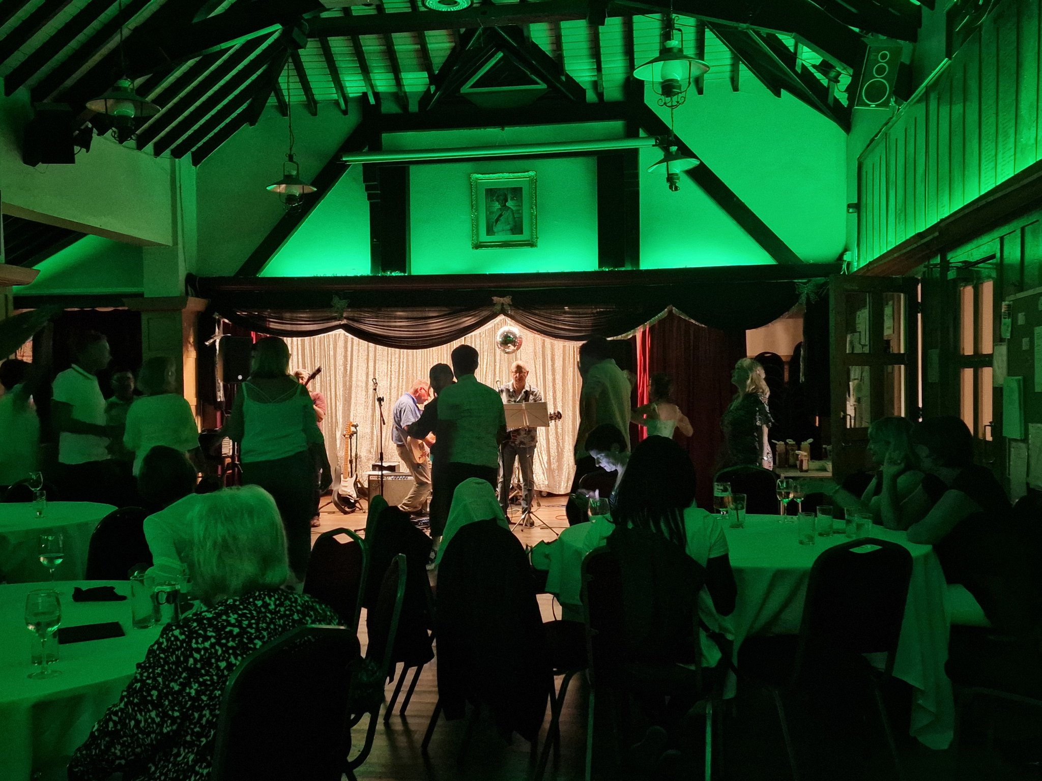 Snooker Hall event at Bush Hill Park Club with green lighting and dining setup.