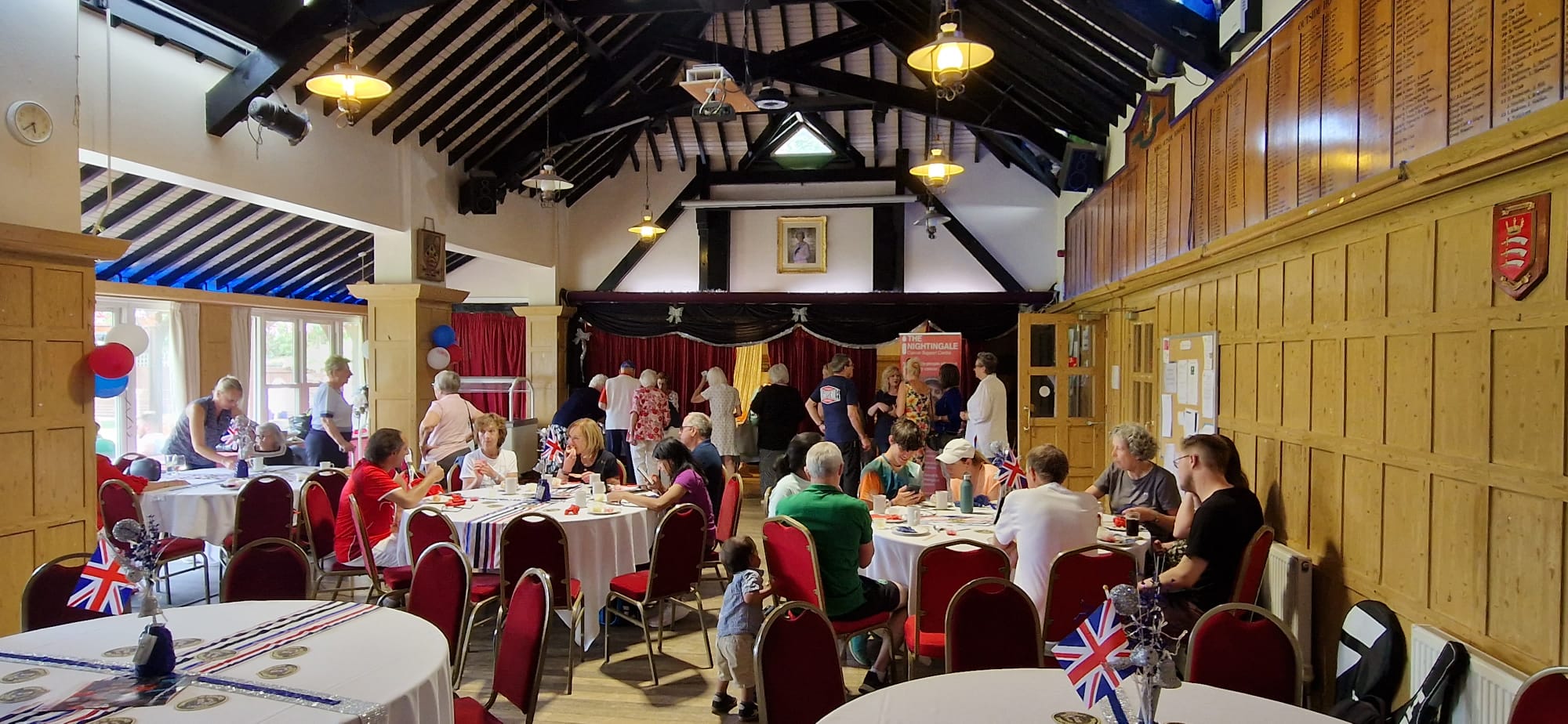 Lively Snooker Hall event with round tables and warm lighting in Bush Hill Park Club.