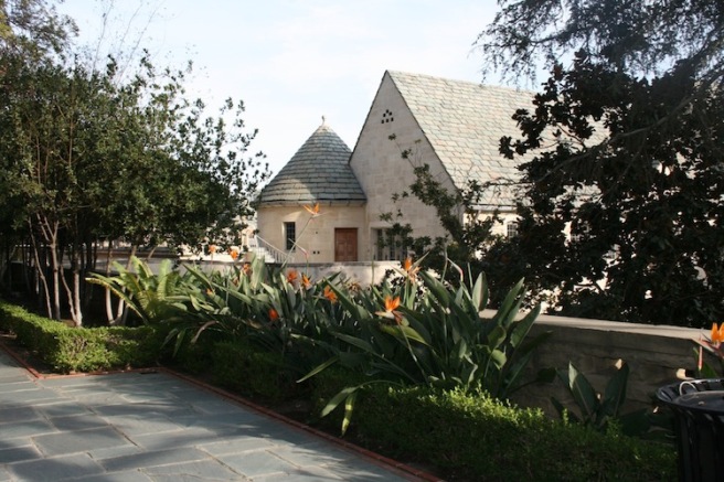 Balcony at Greystone Mansion: lush greenery venue for events and celebrations.