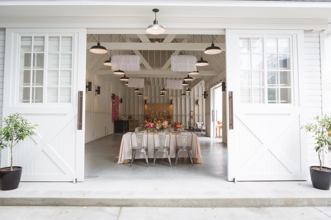 Elegant barn event space with natural light, ideal for weddings and corporate gatherings.
