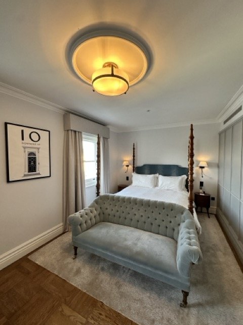 Elegant hotel suite at The Adria, perfect for meetings and retreats.