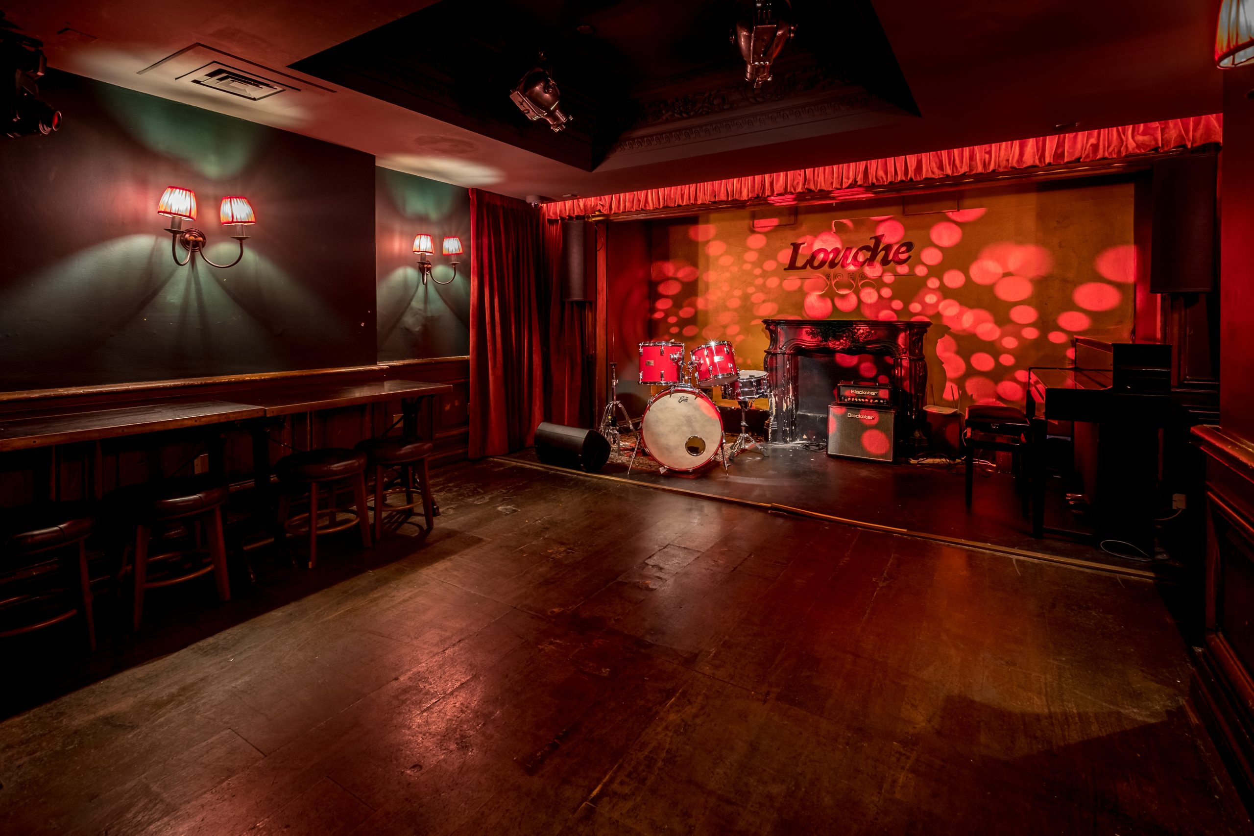 Versatile event space in Louche Soho with stage, ideal for music events and private parties.