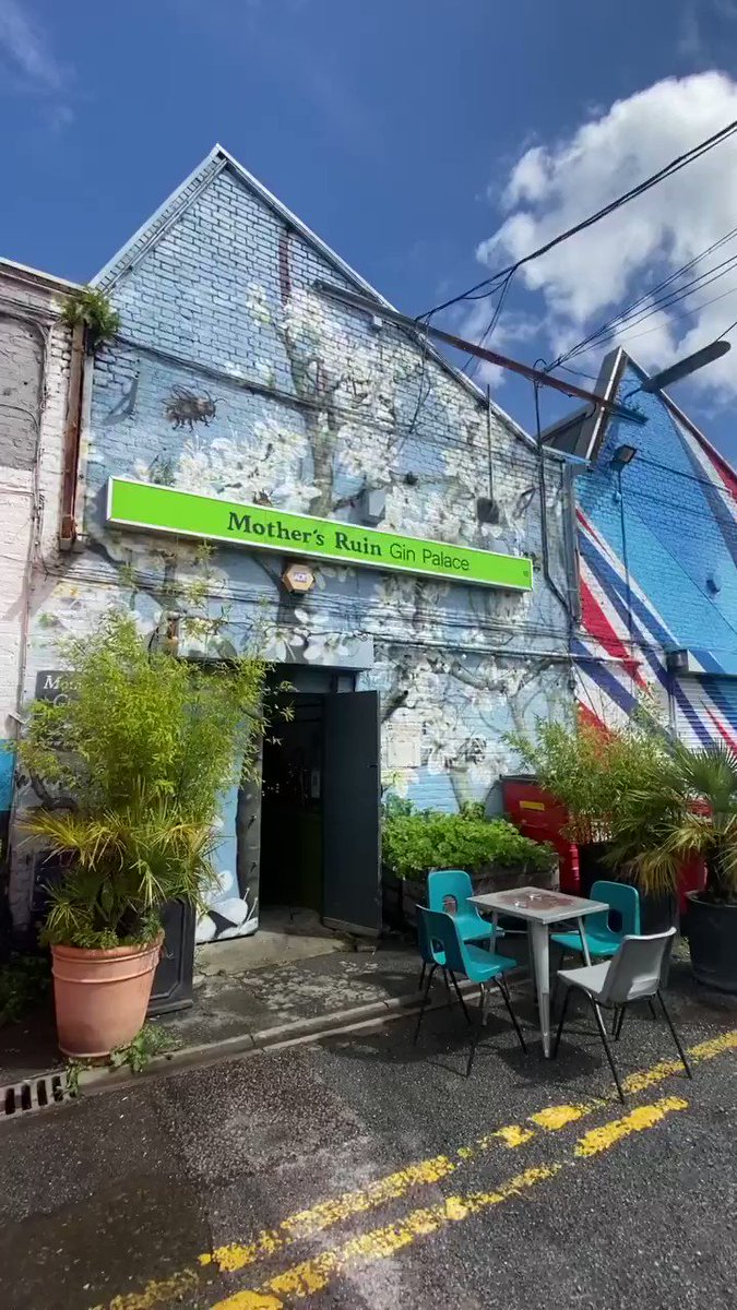 Pillars Brewery at Mother's Ruin Gin Palace with vibrant street art, perfect for events.