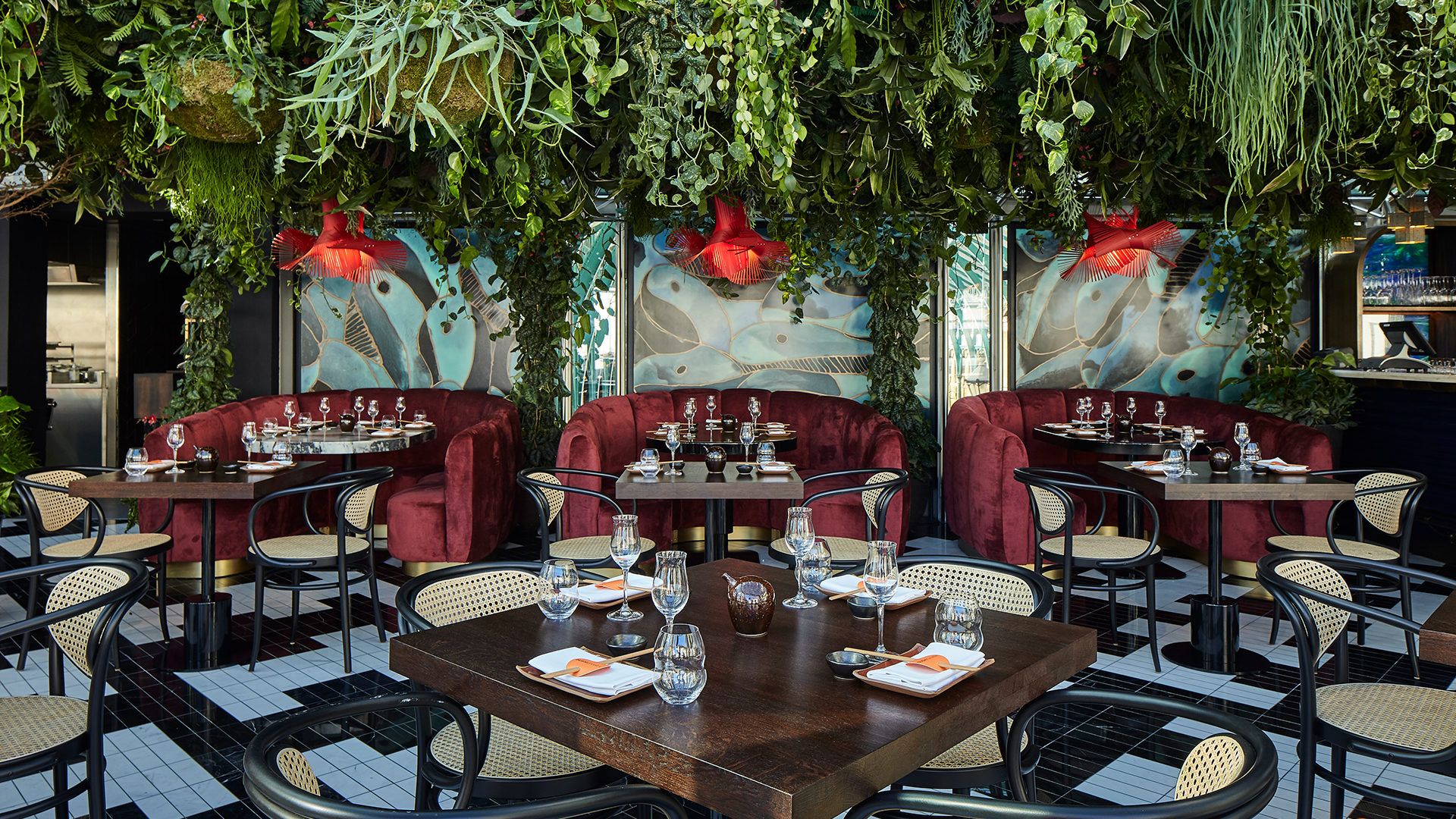 Vibrant SUSHISAMBA Covent Garden dining space with lush greenery for upscale events.