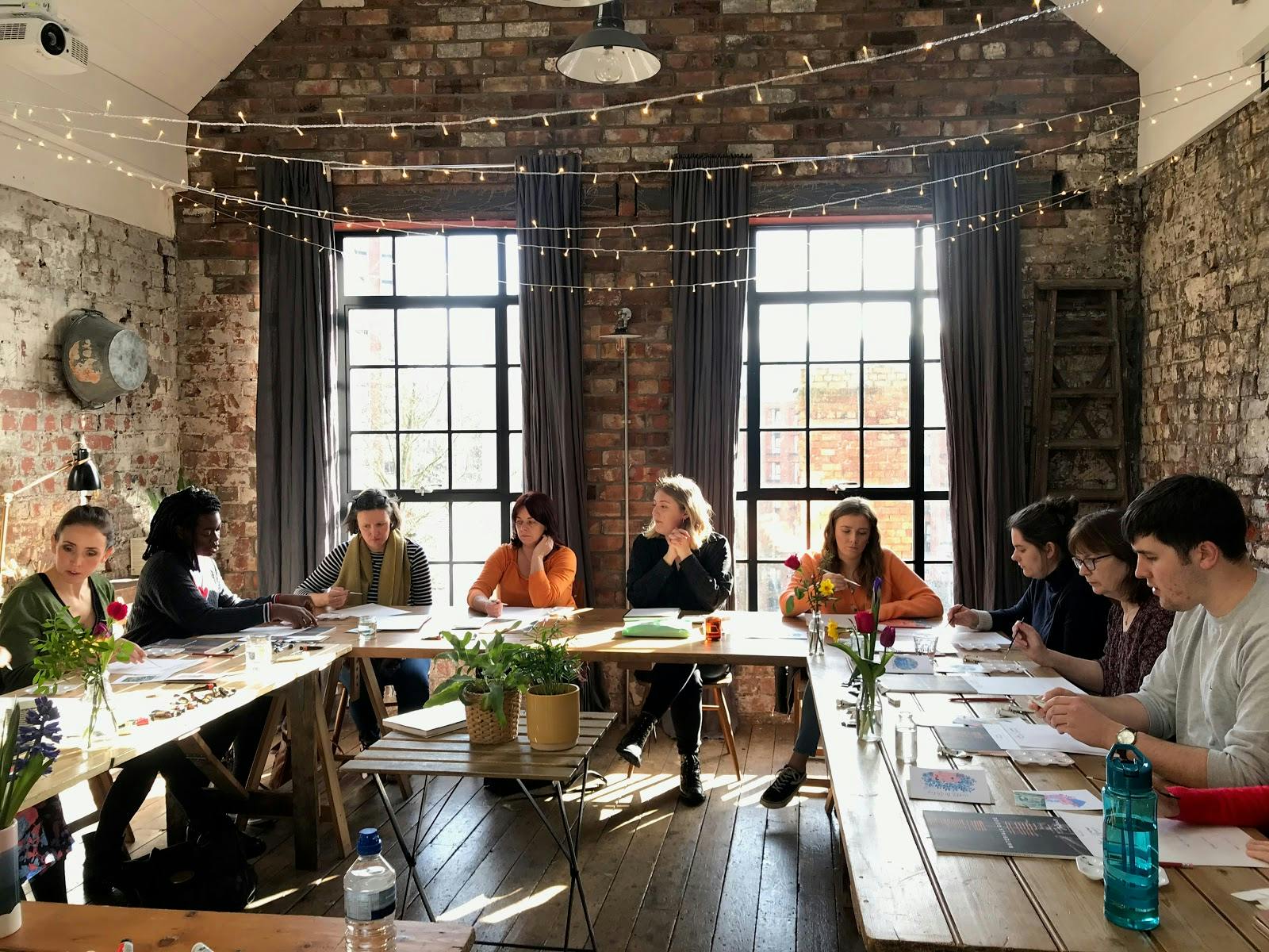 Private dining space with rustic table, ideal for workshops and brainstorming sessions.