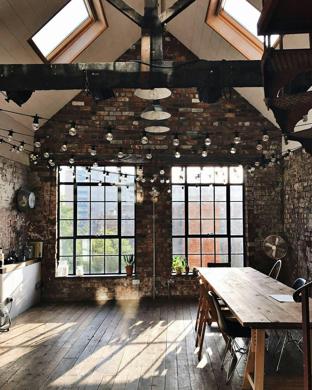 Private dining space with exposed brick walls, perfect for meetings and social gatherings.