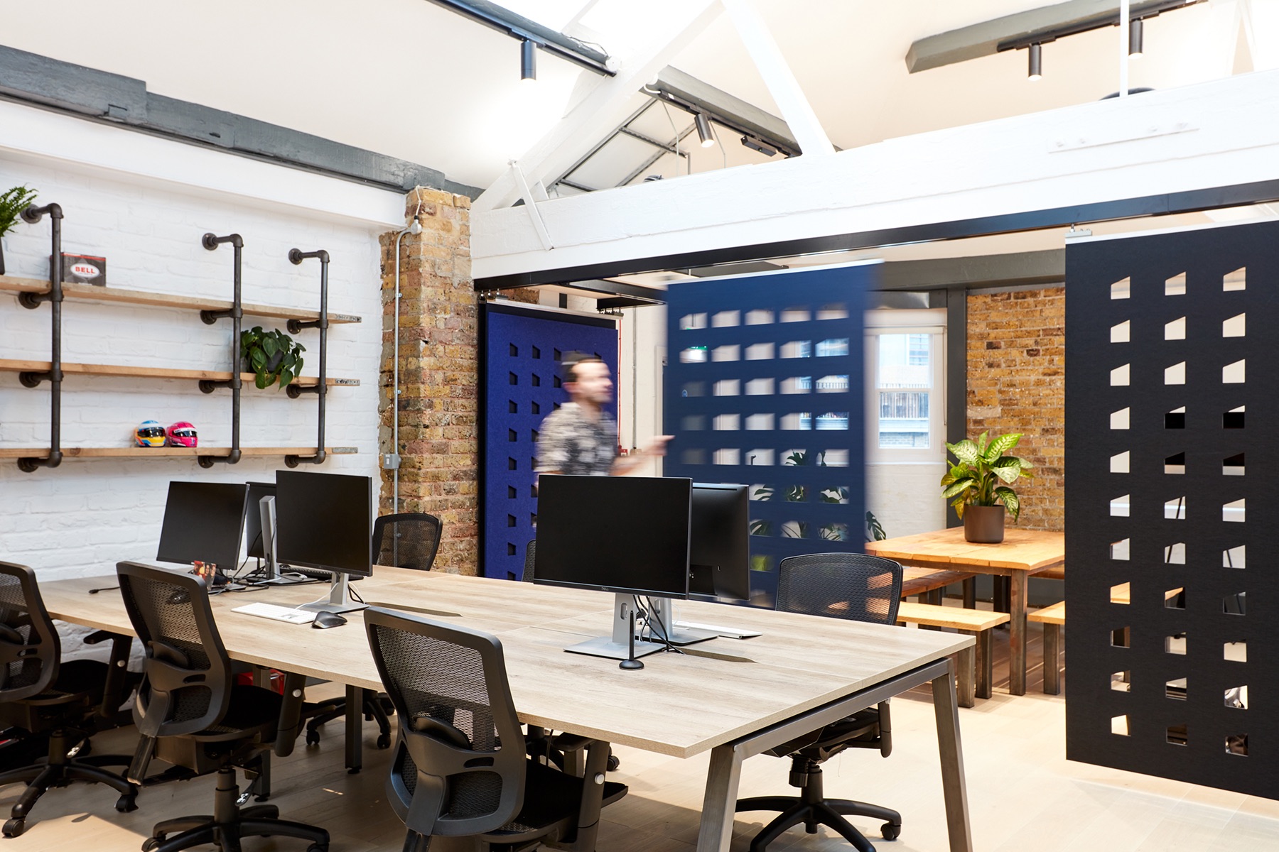 Modern office space at Hutch Games Ltd. with communal table for collaborative events.