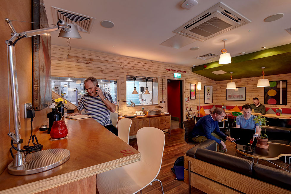 Cozy modern event space with warm wood accents for meetings and collaboration.