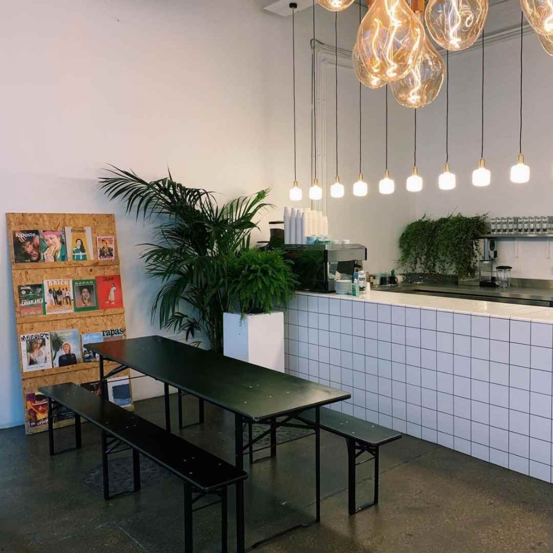 Modern bar at Beechhall Coffee Co. with communal seating for networking events.