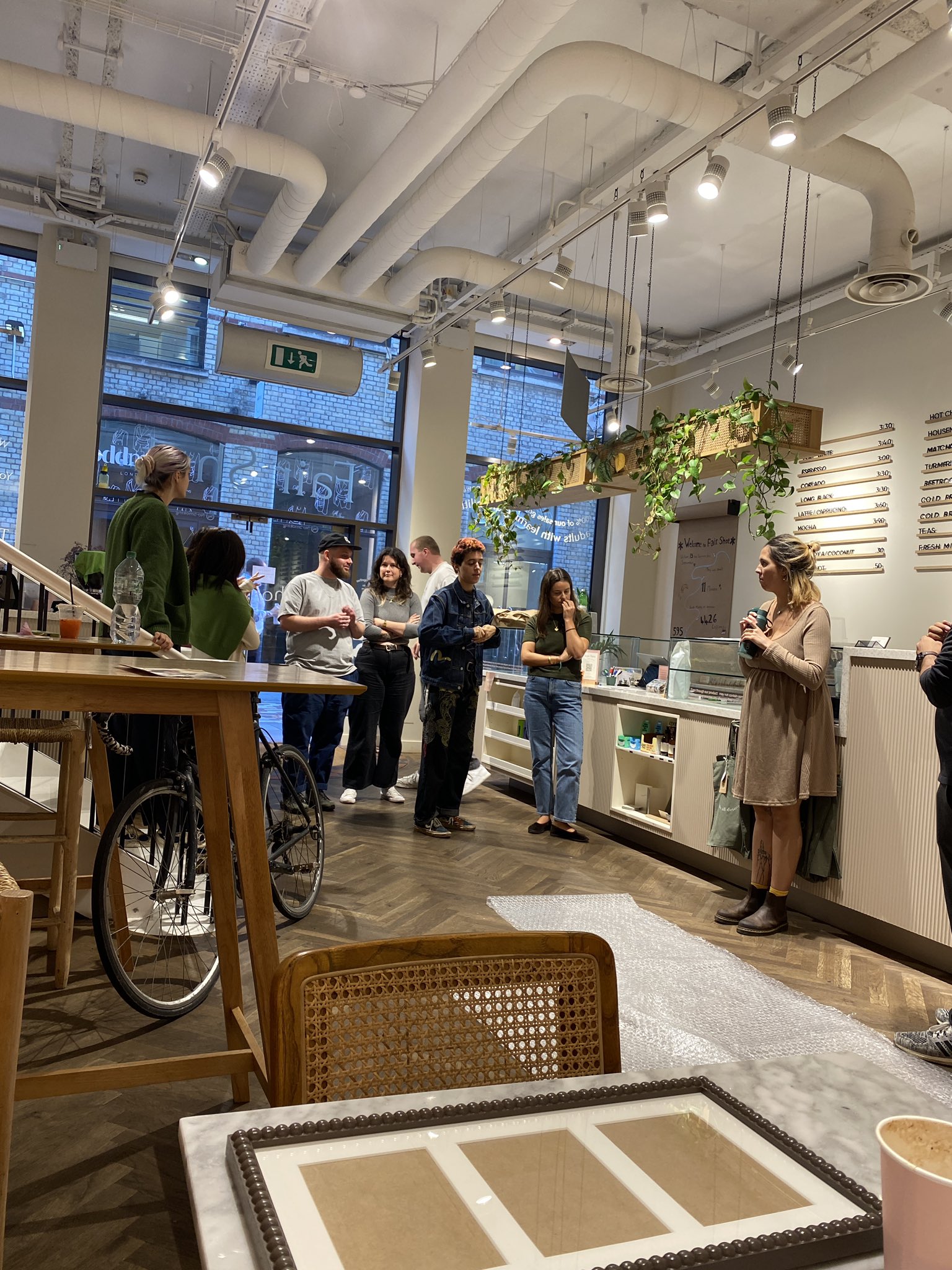 Vibrant Fair Shot Cafe space for networking events with natural decor and casual seating.