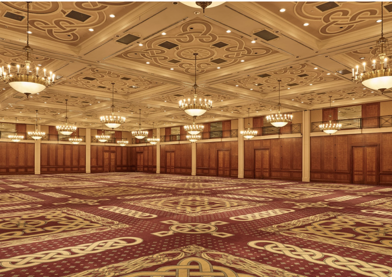 Elegant event hall with chandeliers, perfect for conferences and banquets.