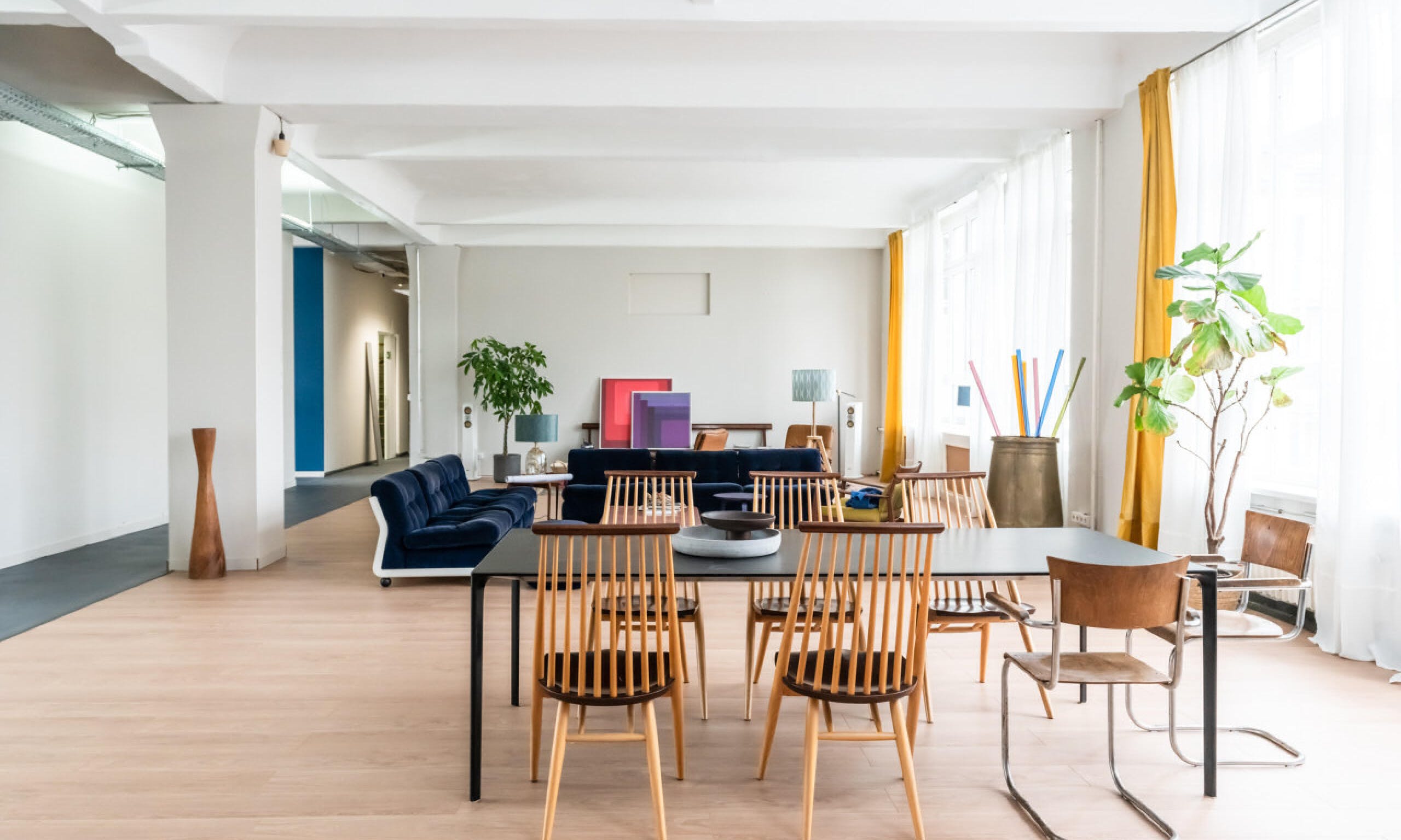 Modern function room with natural light, perfect for workshops and team-building events.