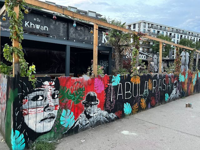 Vibrant outdoor venue with murals for creative events and casual meetups.