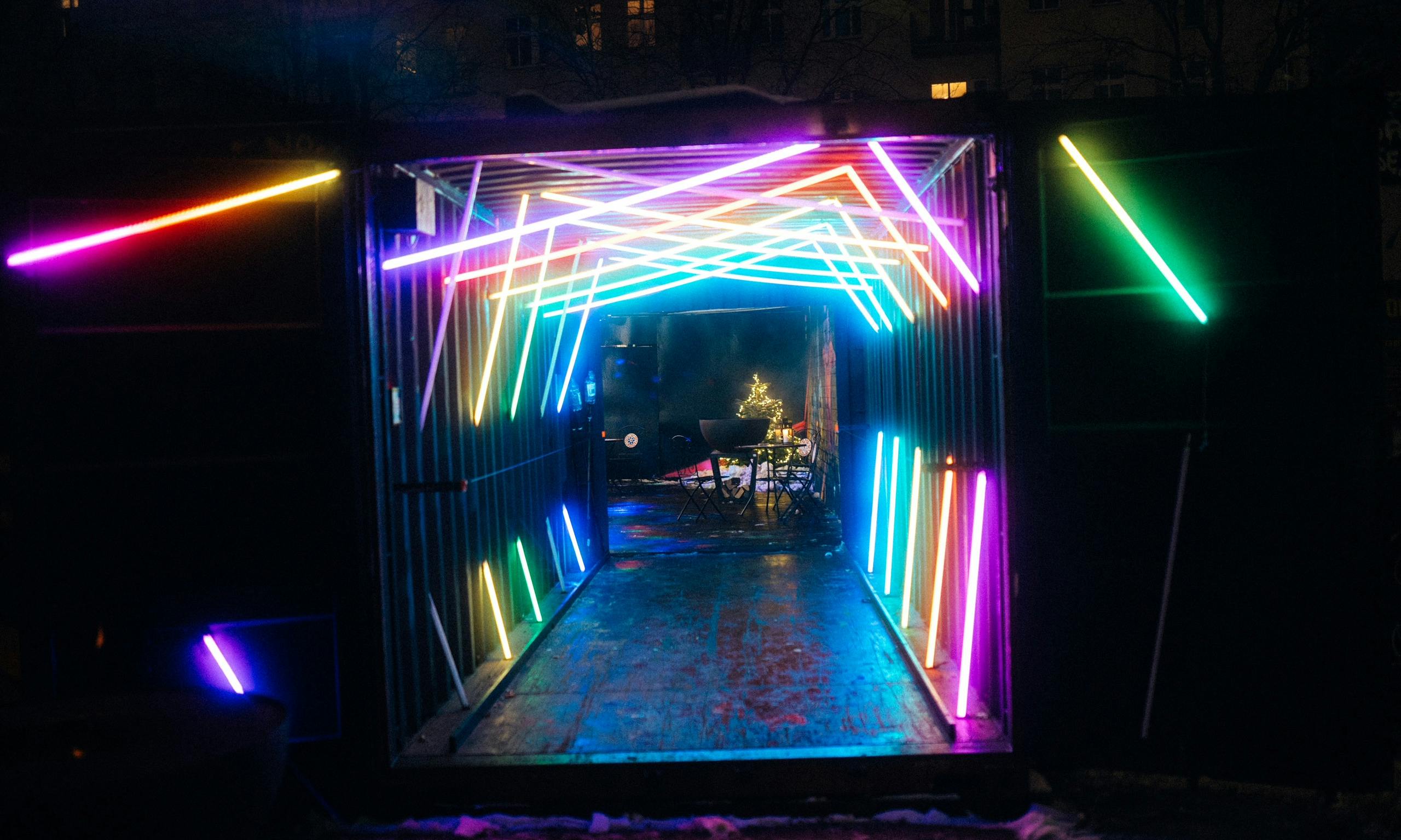 Vibrant neon-lit entrance at TABULA RASA for engaging modern events.