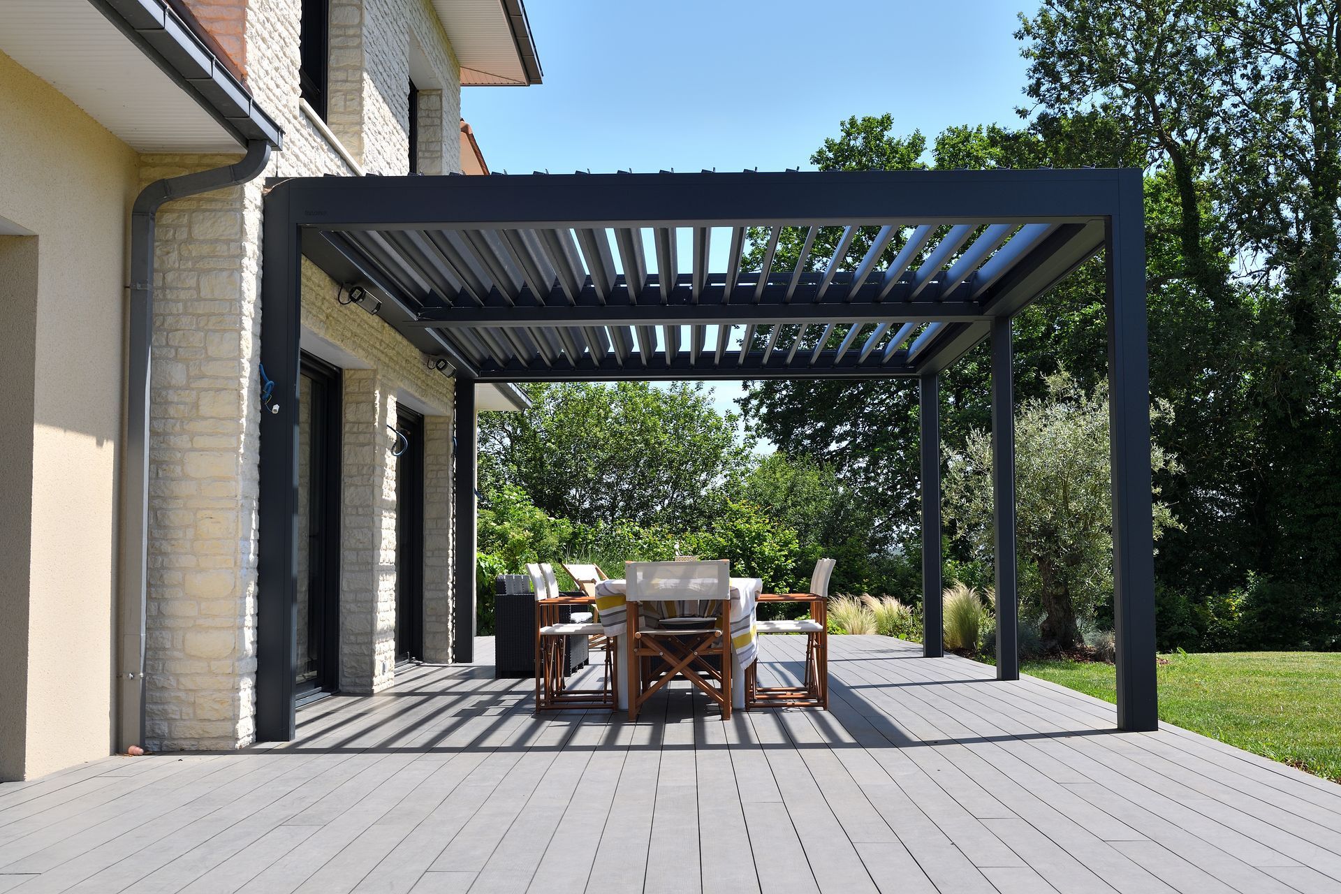 Stylish terrace with modern pergola, perfect for outdoor events and gatherings.