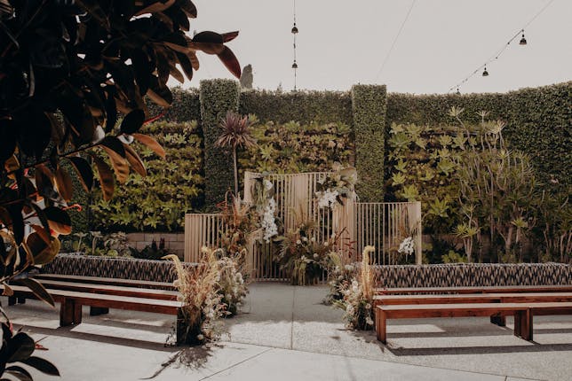 Garden Courtyard at SmogShoppe: lush greenery, ideal for weddings and upscale events.