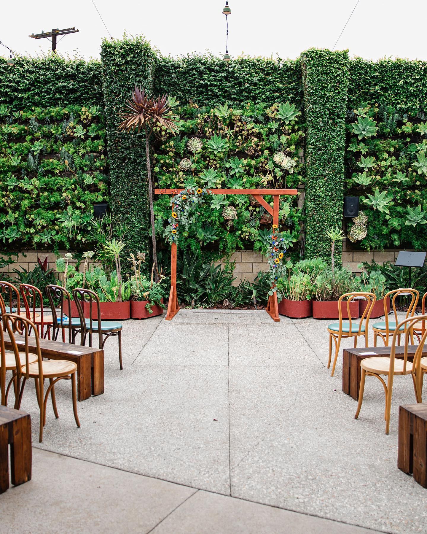 Garden Courtyard at SmogShoppe with floral arch for intimate outdoor ceremonies.