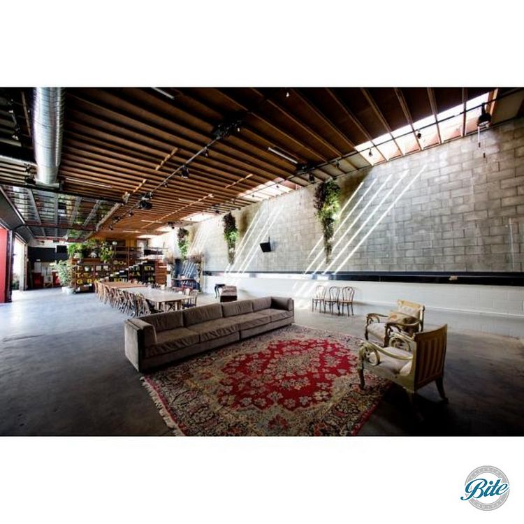 Grand Hall at SmogShoppe: industrial-chic event space with natural light for gatherings.