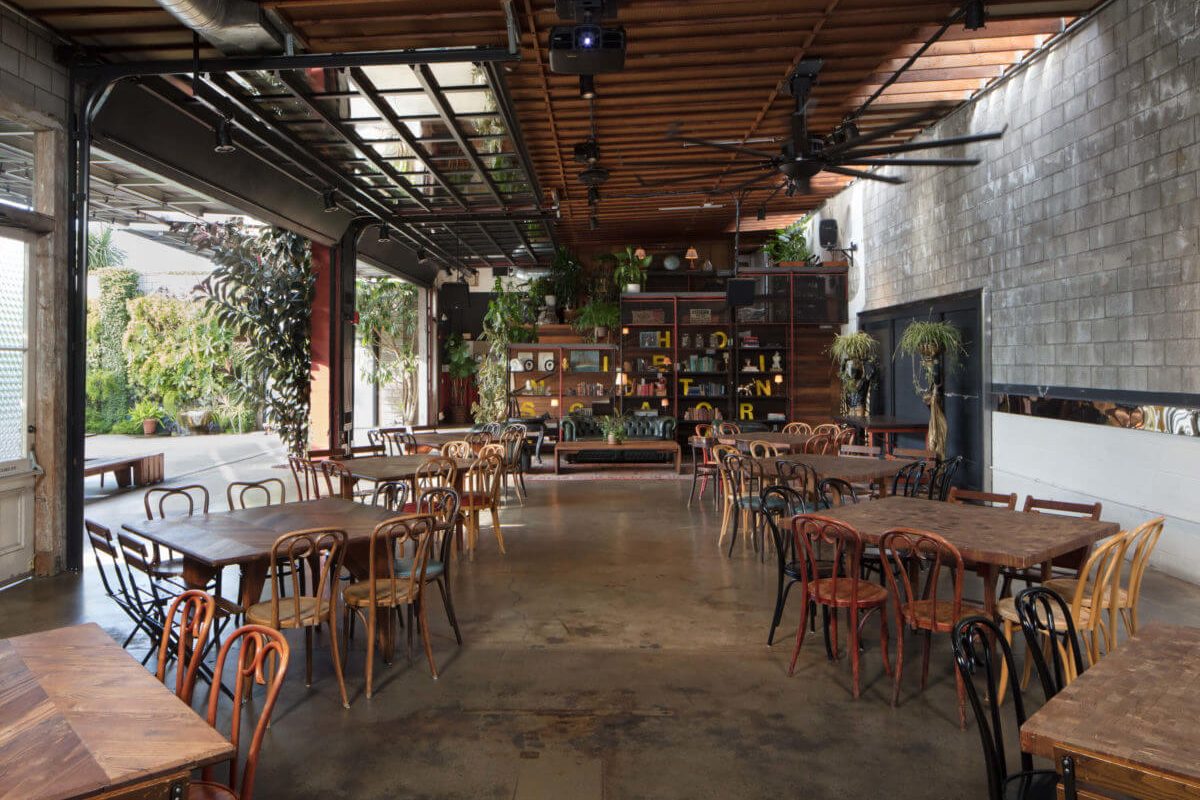 Green Room at SmogShoppe: industrial-chic event space with greenery for gatherings.