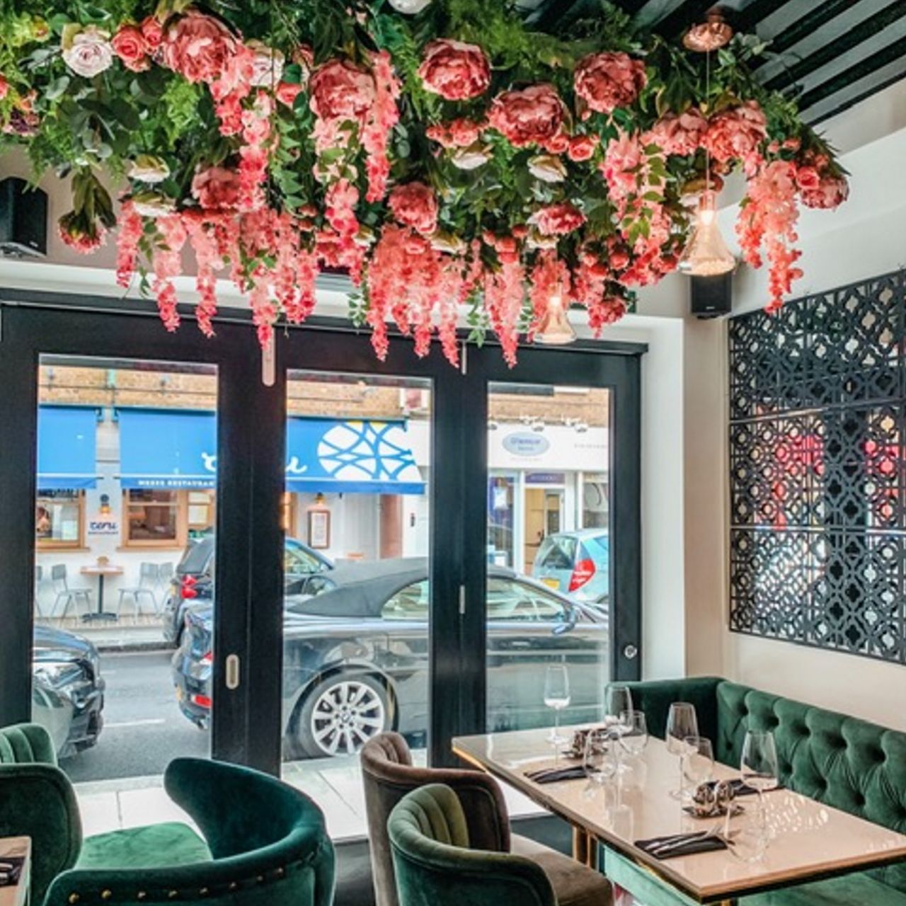 Elegant event space at Eli's Restaurant with floral installation, perfect for upscale gatherings.