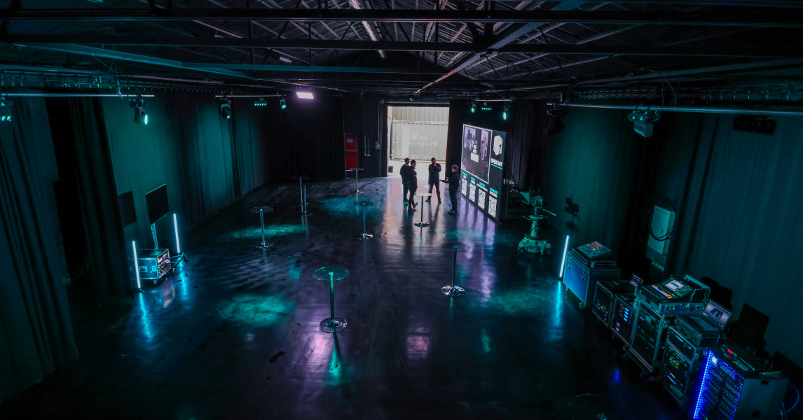 Modern production office venue with high ceilings for corporate events and creative gatherings.