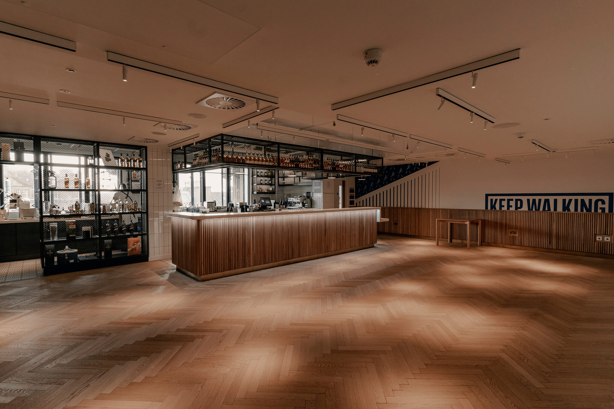 Stylish event space at Label Studio, featuring a sleek bar for networking and receptions.