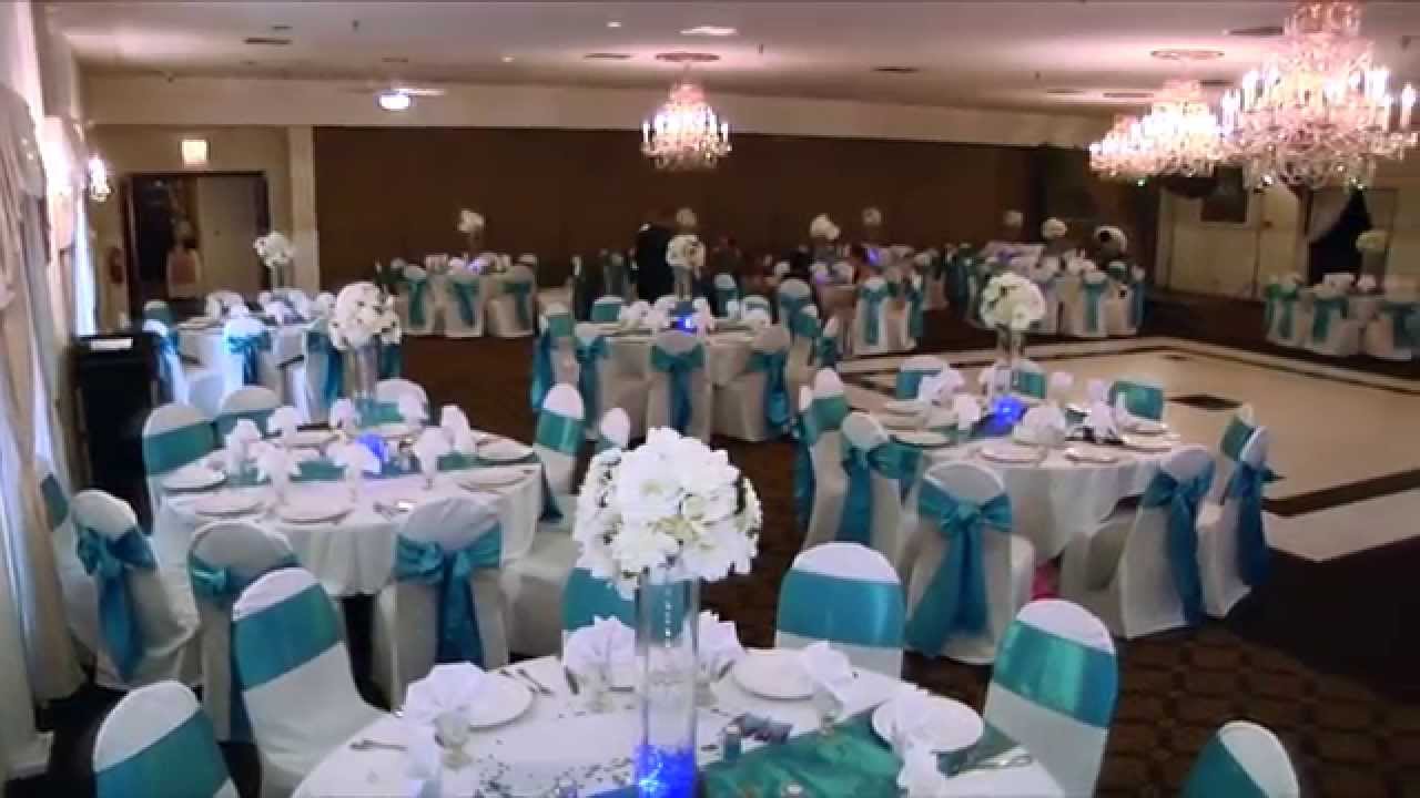Elegant banquet hall with turquoise accents, perfect for weddings and formal events.