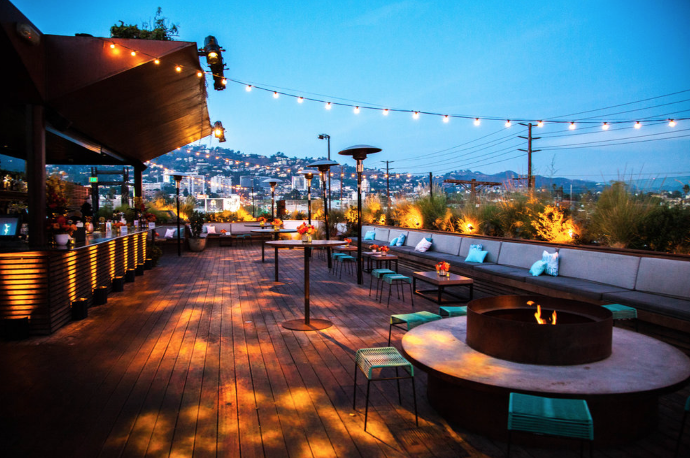Stylish rooftop venue with fire pit, ideal for cocktail receptions and intimate gatherings.