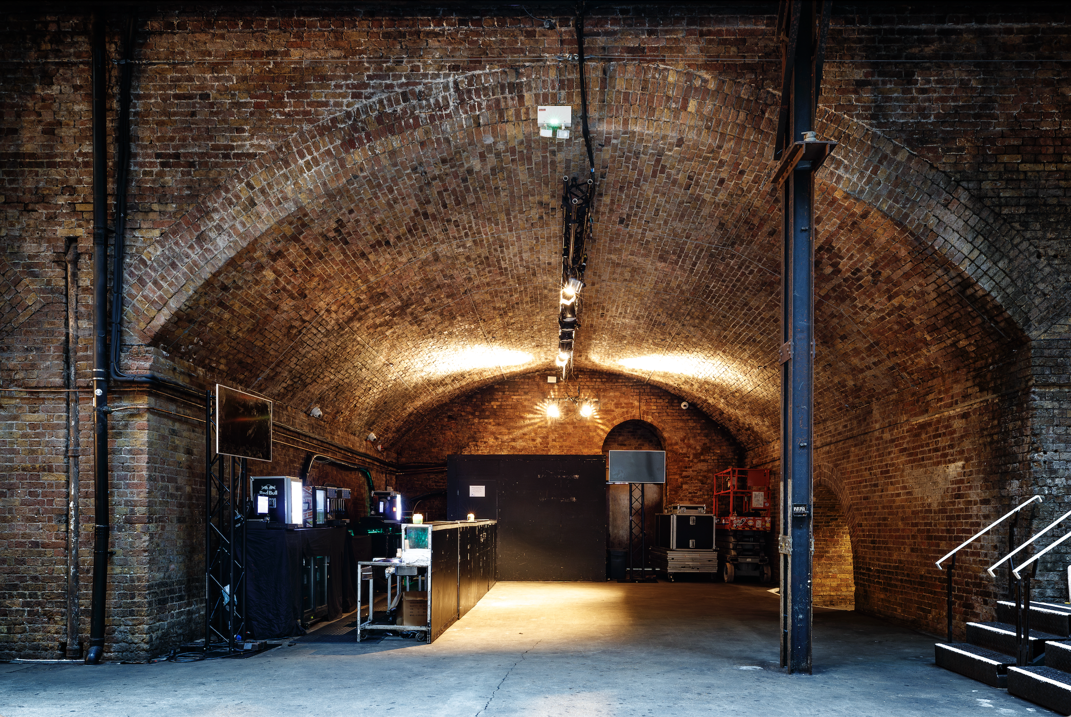 Versatile event space at Village Underground with rustic brick arches for gatherings.