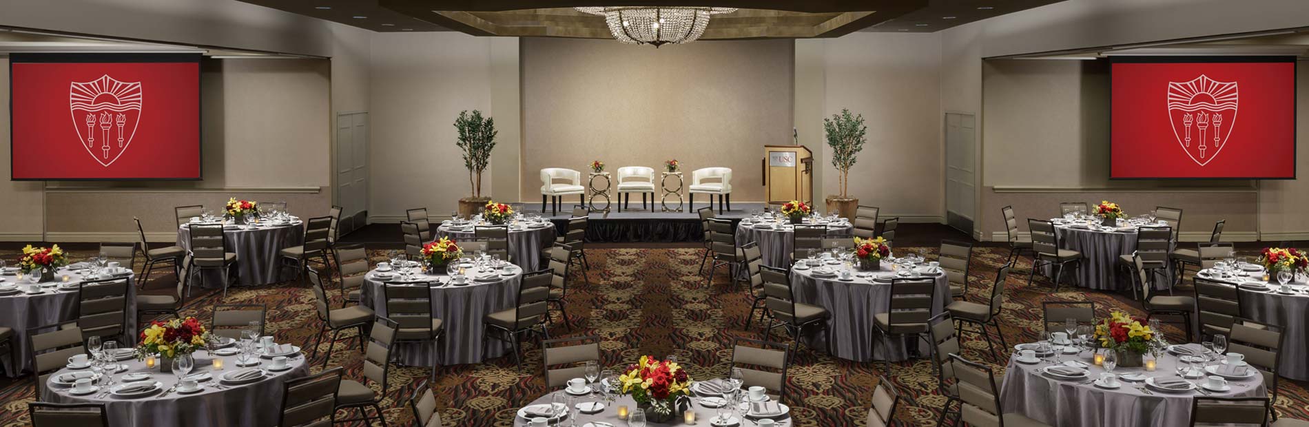 Elegant conference hall with round tables, ideal for formal gatherings and presentations.