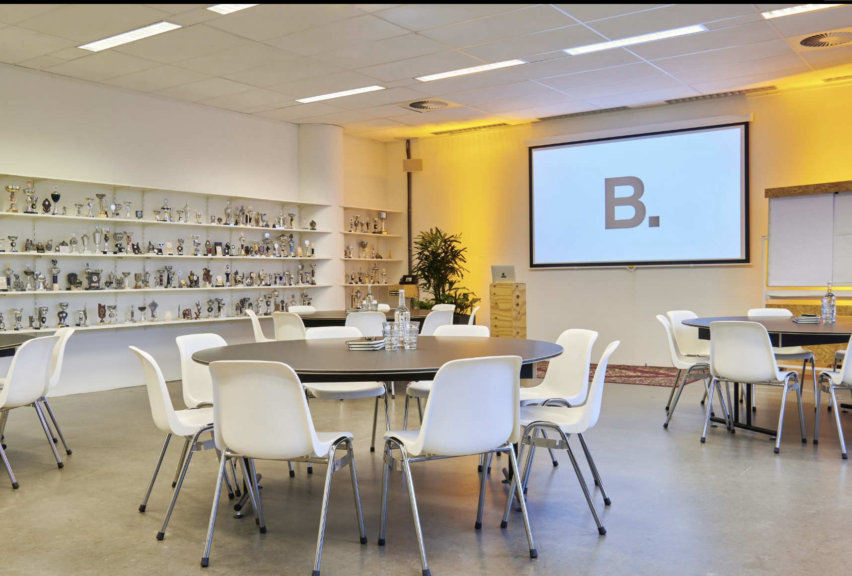 Modern meeting space at The Chris, B. Amsterdam with round tables for collaborative events.