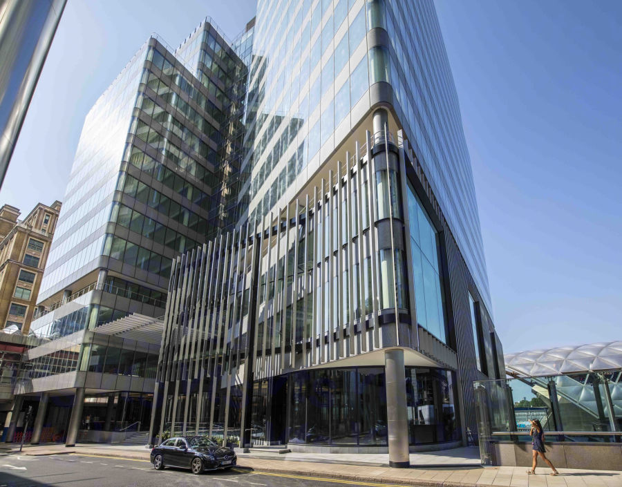 Modern glass building at Canary Wharf, ideal for corporate events and meetings.