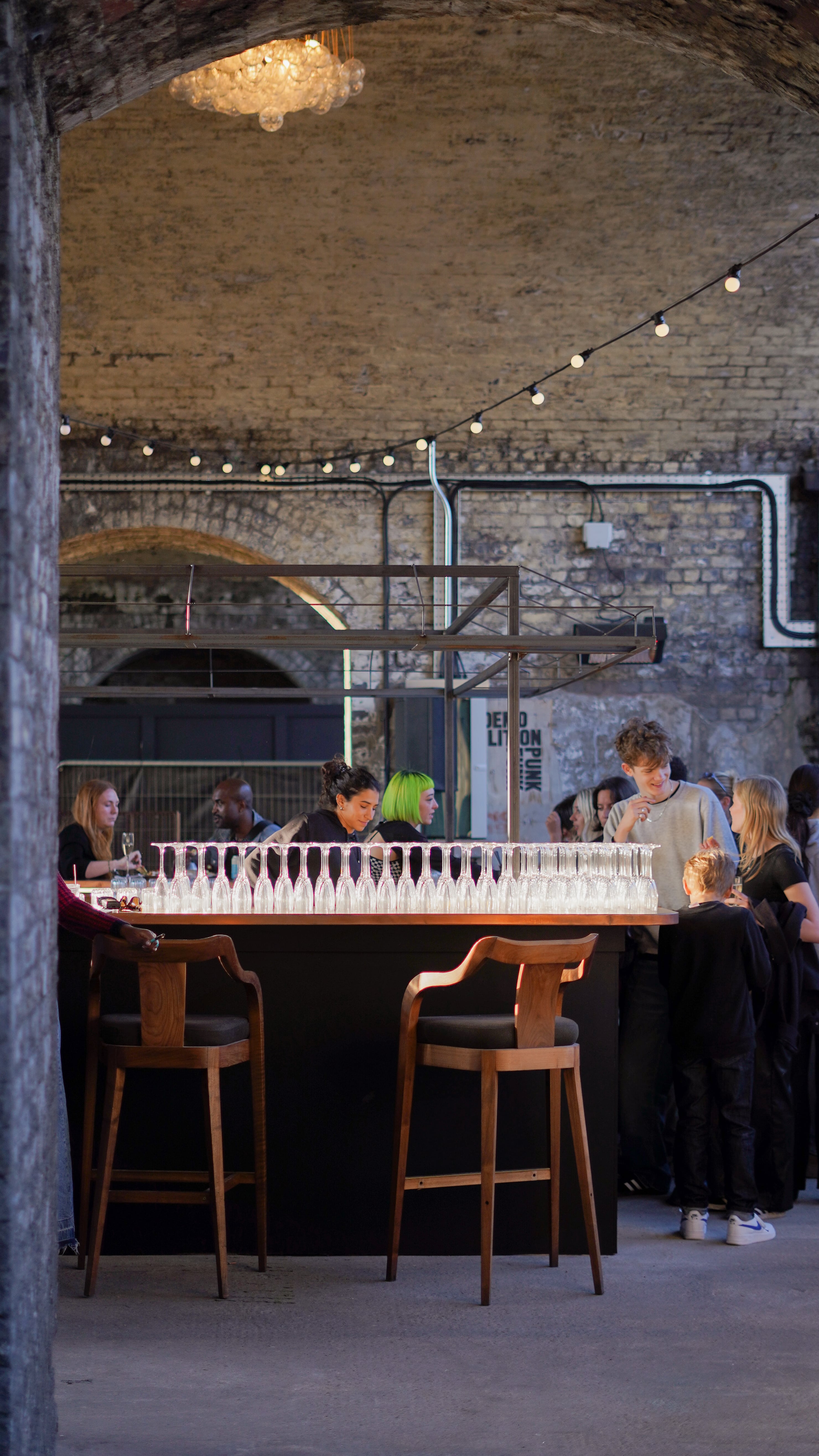 Vibrant Five Points Taproom courtyard with sleek bar, ideal for networking events.