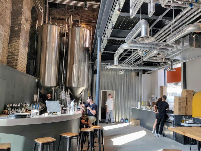Private Stack Room at Sambrook's Brewery Tap, featuring stainless steel tanks for events.
