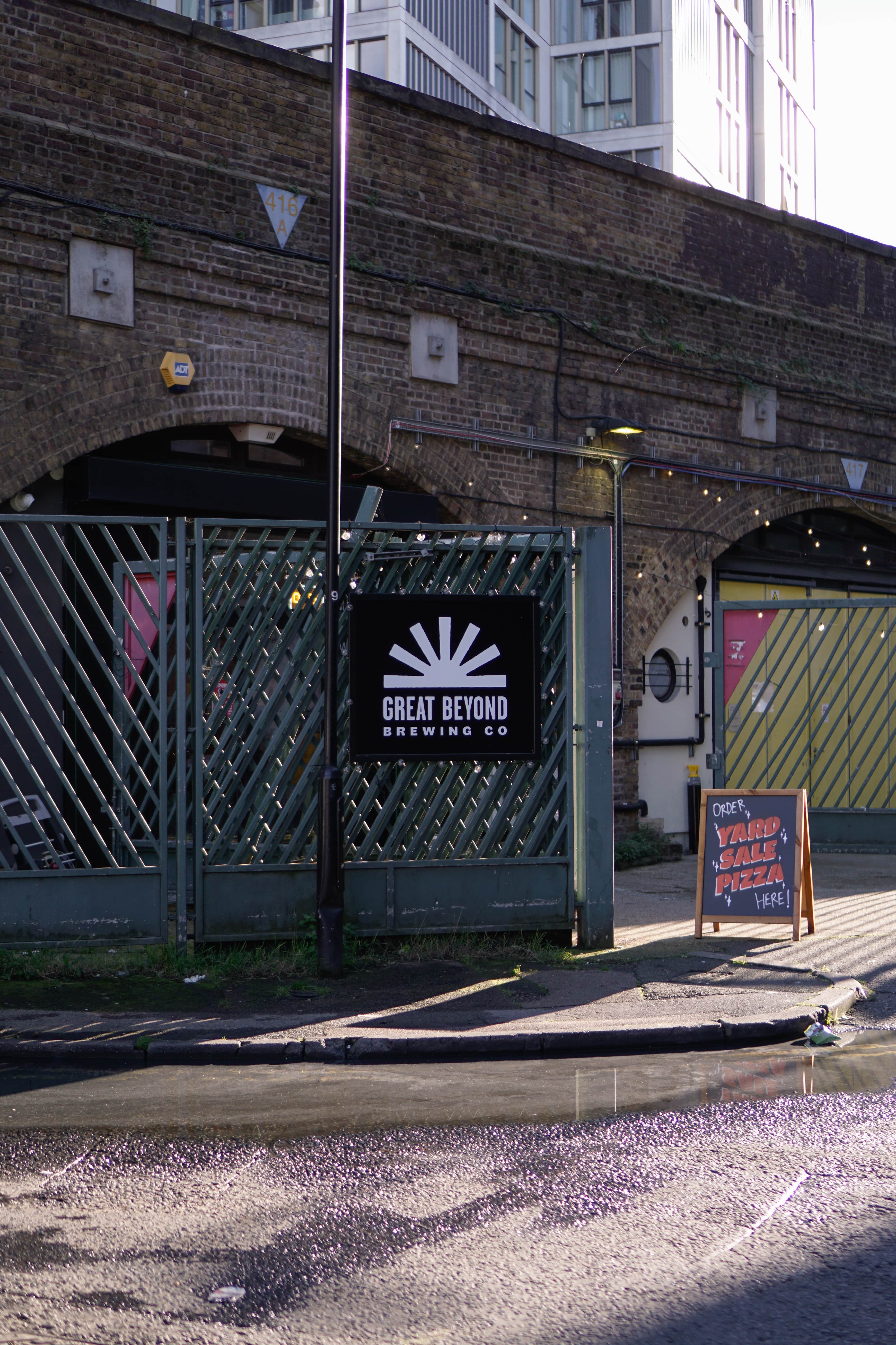 "Great Beyond Brewing Co. beer garden entrance with string lights for casual events."