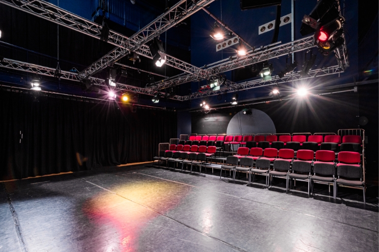 Black Room at The Boardwalk: tiered seating for presentations and performances, ideal for events.