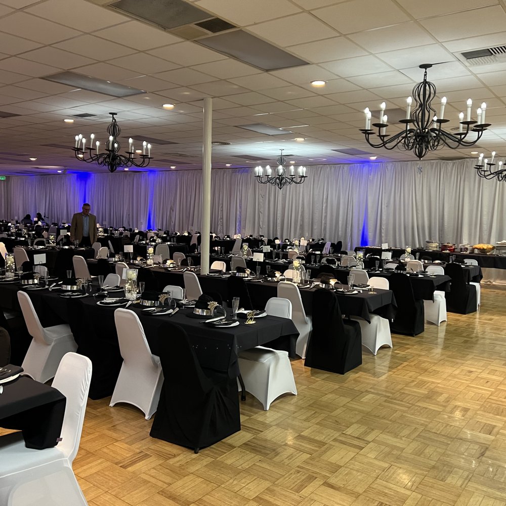 Elegant banquet hall with black and white decor for formal events and gatherings.
