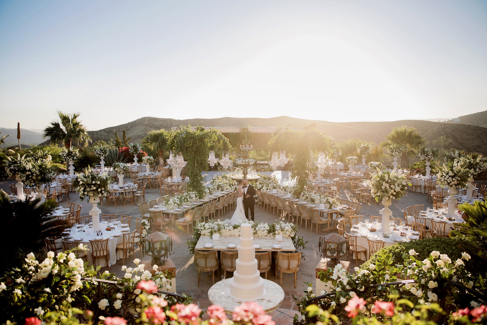 Elegant wedding setup by Anoush Catering at Middle Ranch with floral centerpieces.