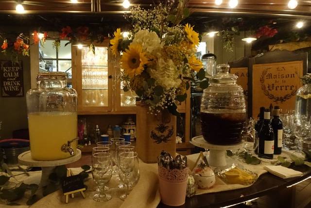 Bar/lounge area with floral centerpiece, perfect for events and gatherings.