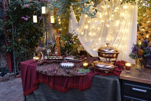 Elegant buffet setup under covered patio in Bexx Secret Garden for outdoor weddings.