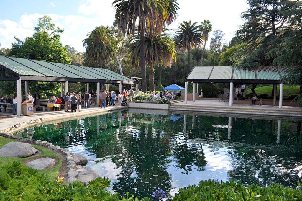 Banquet hall at Grace E. Simons Lodge with lush greenery, perfect for outdoor events.