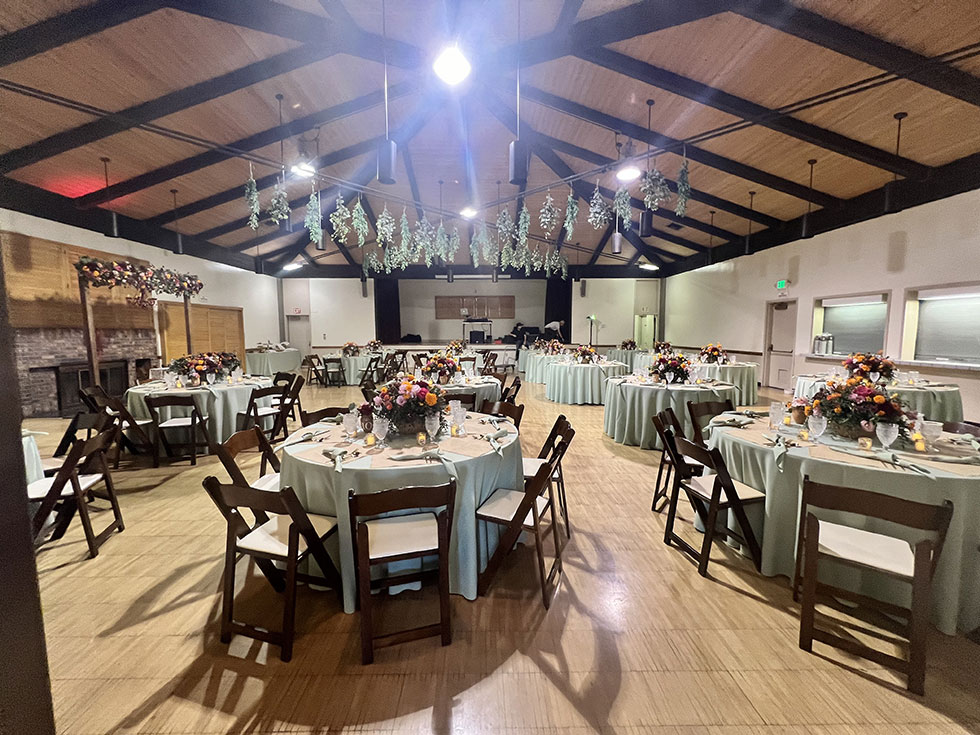 Banquet hall at Grace E. Simons Lodge with blue linens, perfect for weddings and events.