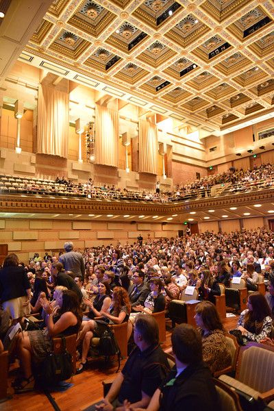 Packed Royce Hall auditorium with tiered seating for a successful conference event.
