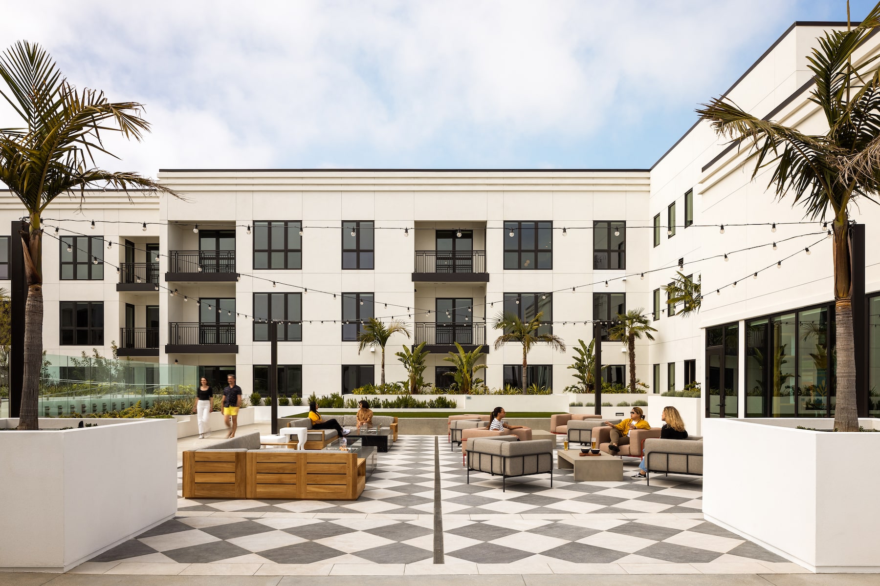 Stylish outdoor event space at Social Hub, Hollywood Park with modern architecture and greenery.